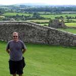 Kevin on the grounds, other ruins in distance