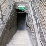 Stairs leading down to the kitchen and basement