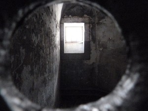 Looking through a peep hole into a cell in the old wing