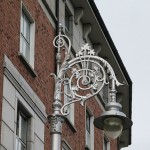 Multiple shamrocks on this streetlamp