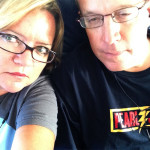 Kevin & Dawn in PJ shirts on the flight to CVG